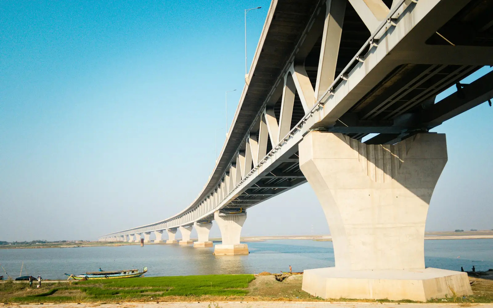Concrete bridge on tall piers spanning a river
