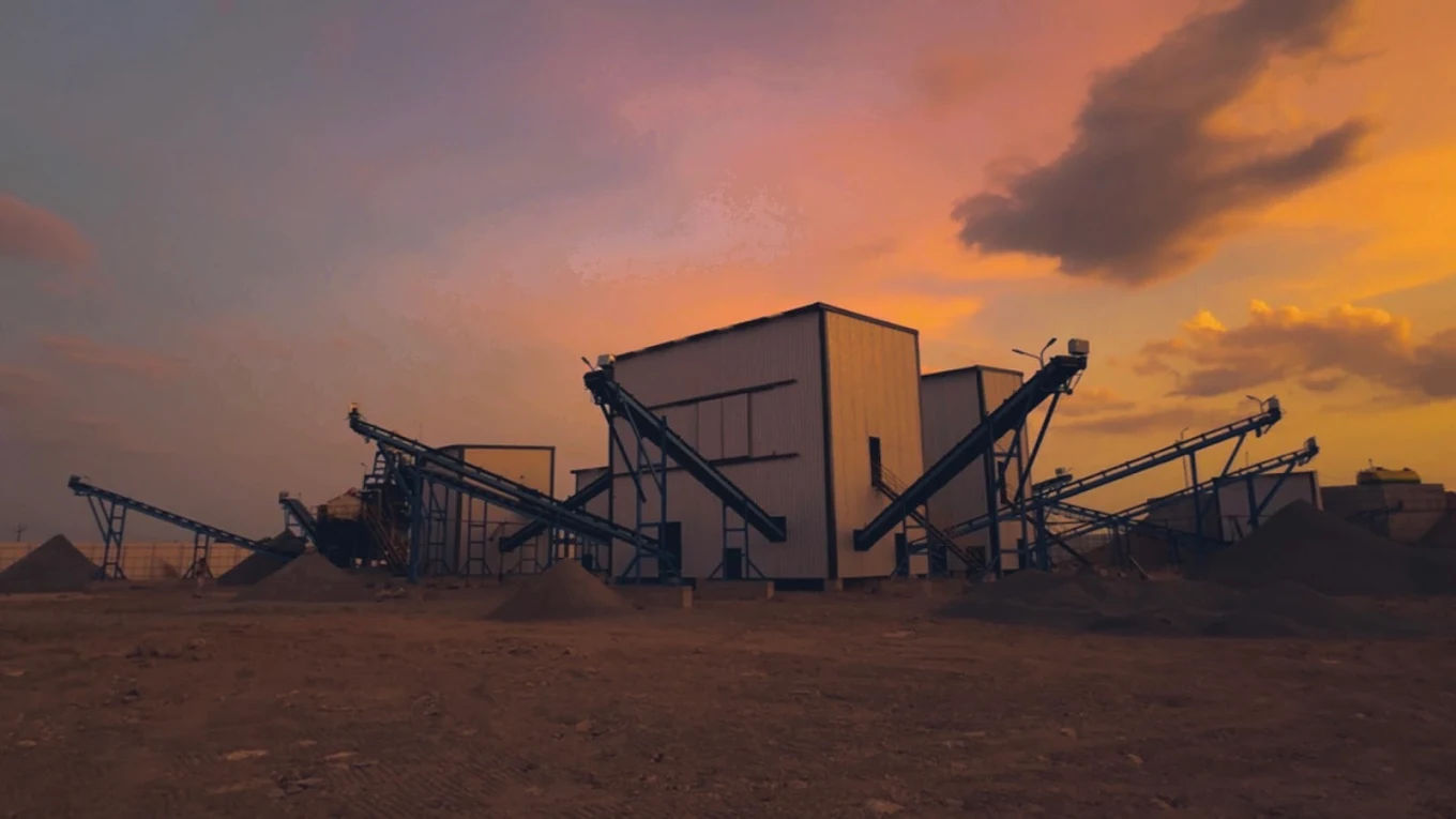Stockpiles of graded aggregate beside the crushing and screening plant